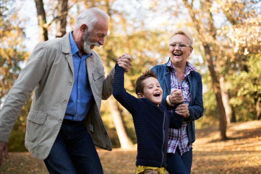 Grandparents enjoy the outdoors with their young grandson