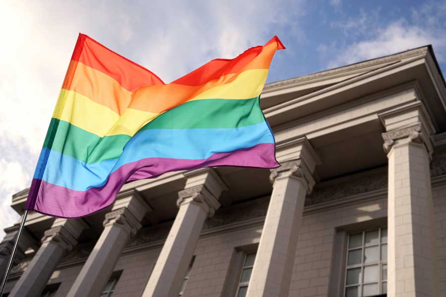Rainbow flag waving in front of courthouse